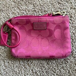 Well loved Coach pink wristlet